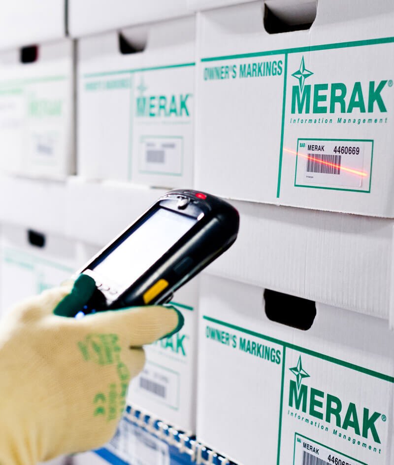 An archive box from Merak is scanned
